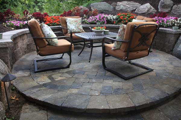 Paver patio with red patio set