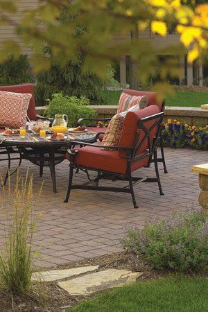 Paver patio with red patio set