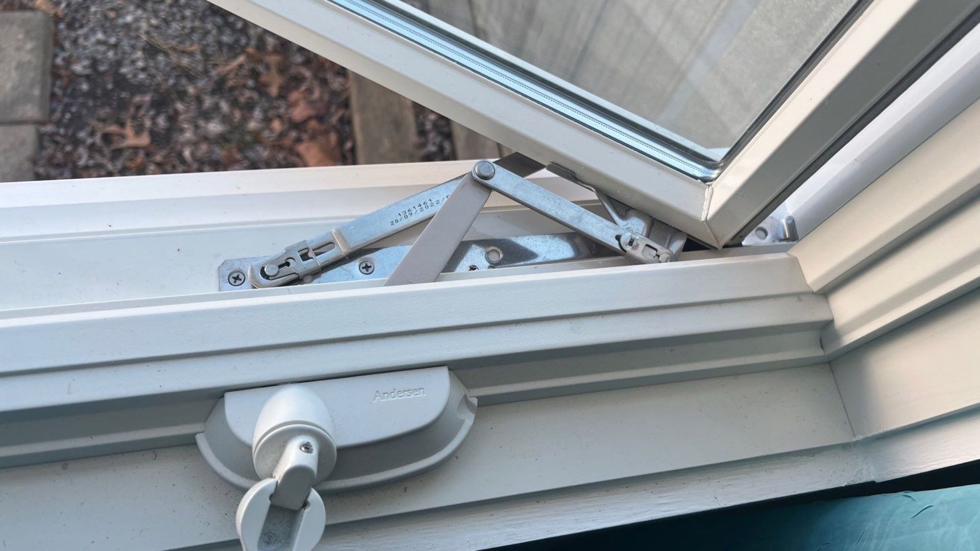 A close up of a window with a lock on it.