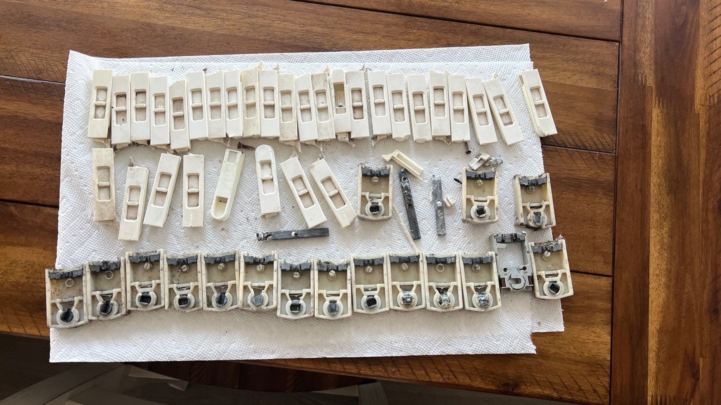 A bunch of electrical connectors are sitting on a napkin on a wooden table.