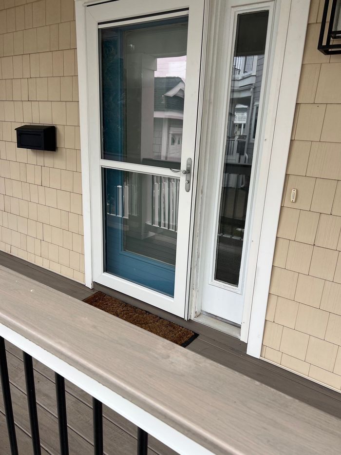 Worker installing new window in house