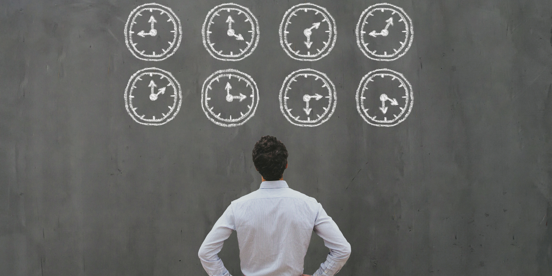 A person is holding a clock in their hand