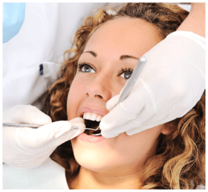 Female Patient Receiving Dental Exam