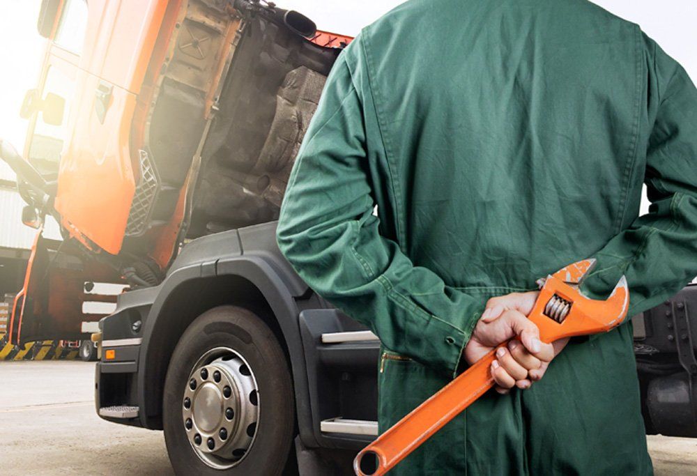 Mechanic Holding Big Wrench — Altoona, IA — Central Trailer Service