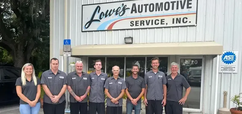 A group of people standing in front of a building.