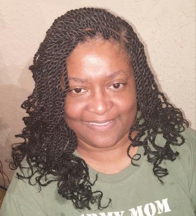 A woman wearing a green shirt that says army mom