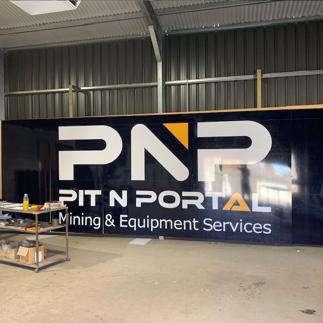 A large sign that says pnr pit n portal mining & equipment services