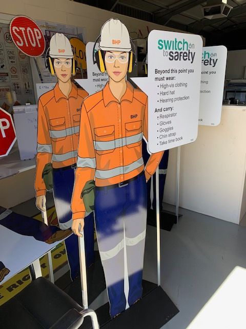 A sign that says switch on safety on it