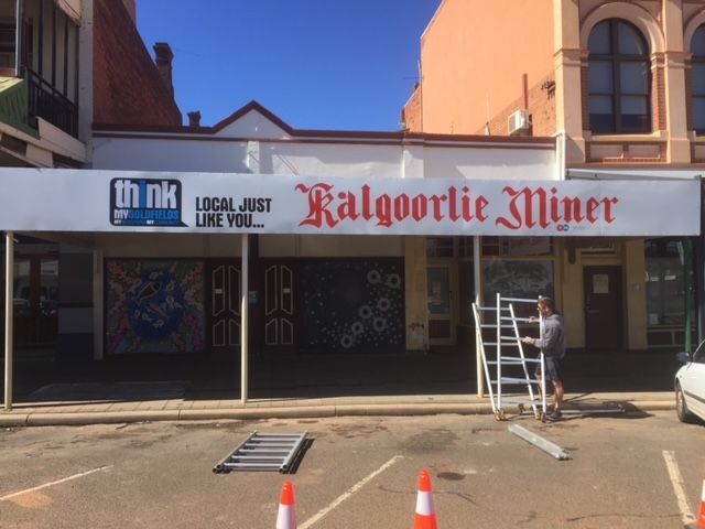 A sign that says kalgoorlie miner on it