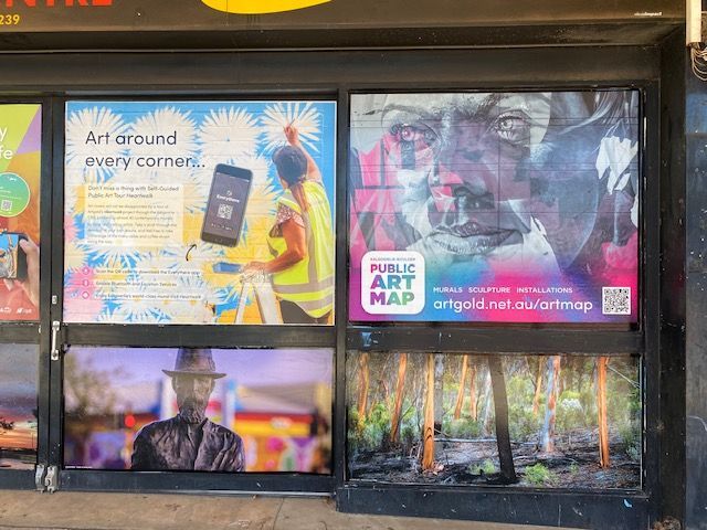 A store front with a lot of posters on it.