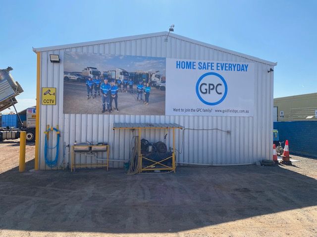 A building with a sign that says home safe everyday gpc