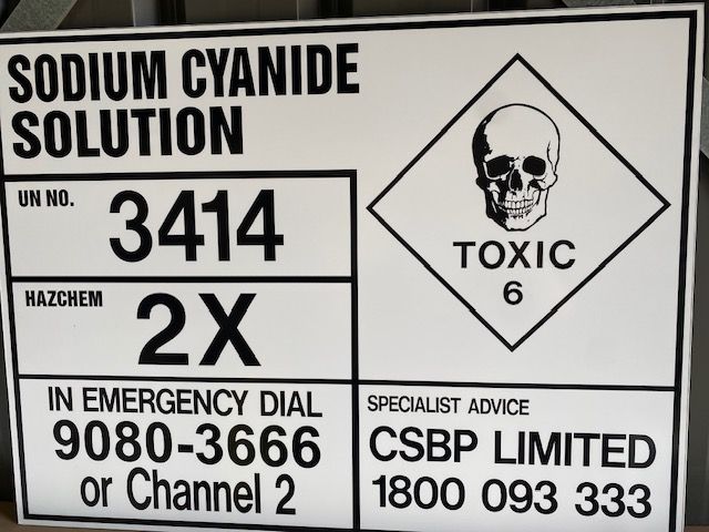 A sign that says sodium cyanide solution on it