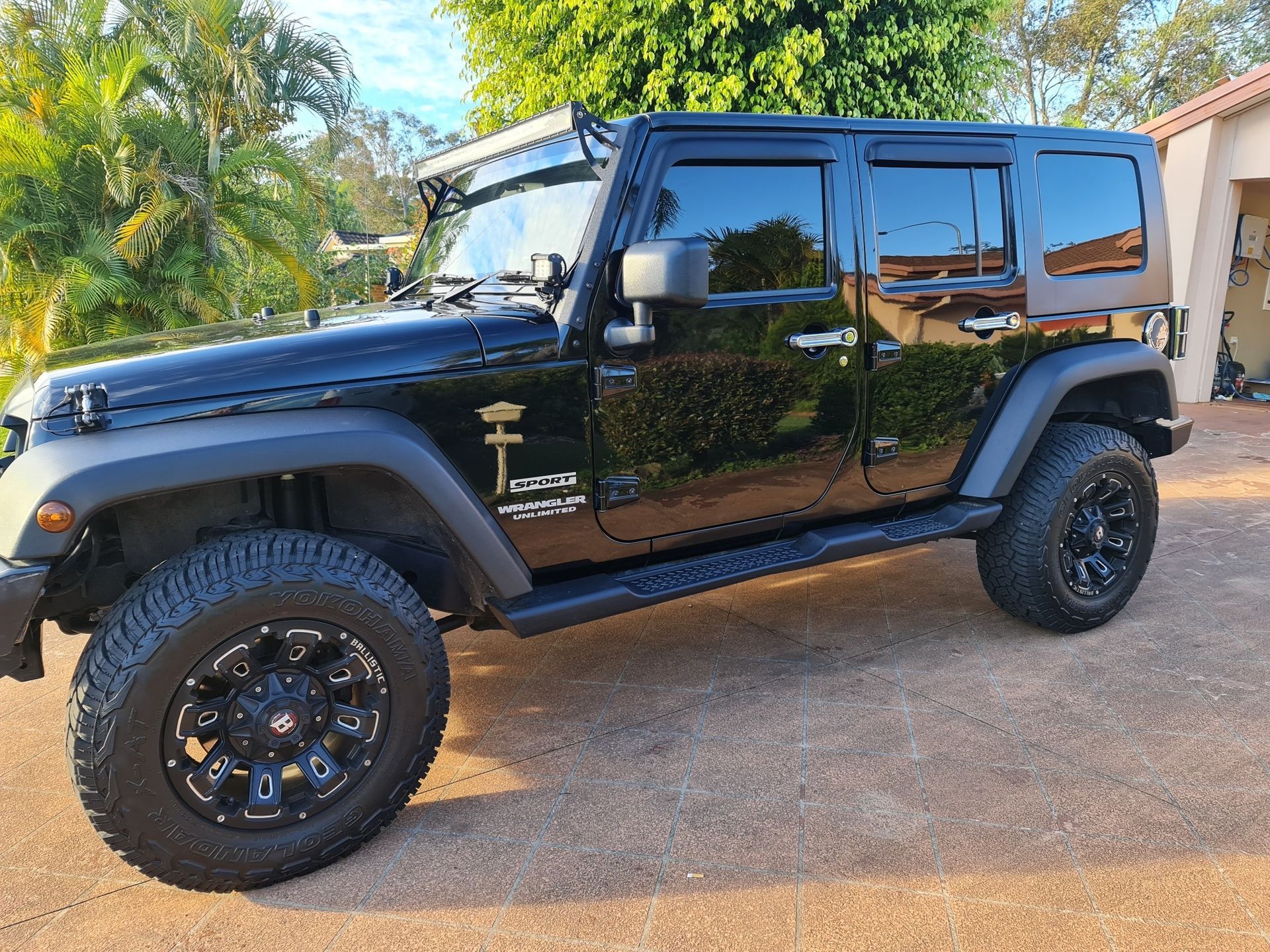 A black 4WD car With a  Tinted windows — PJ Tinting In Port Macquarie, NSW