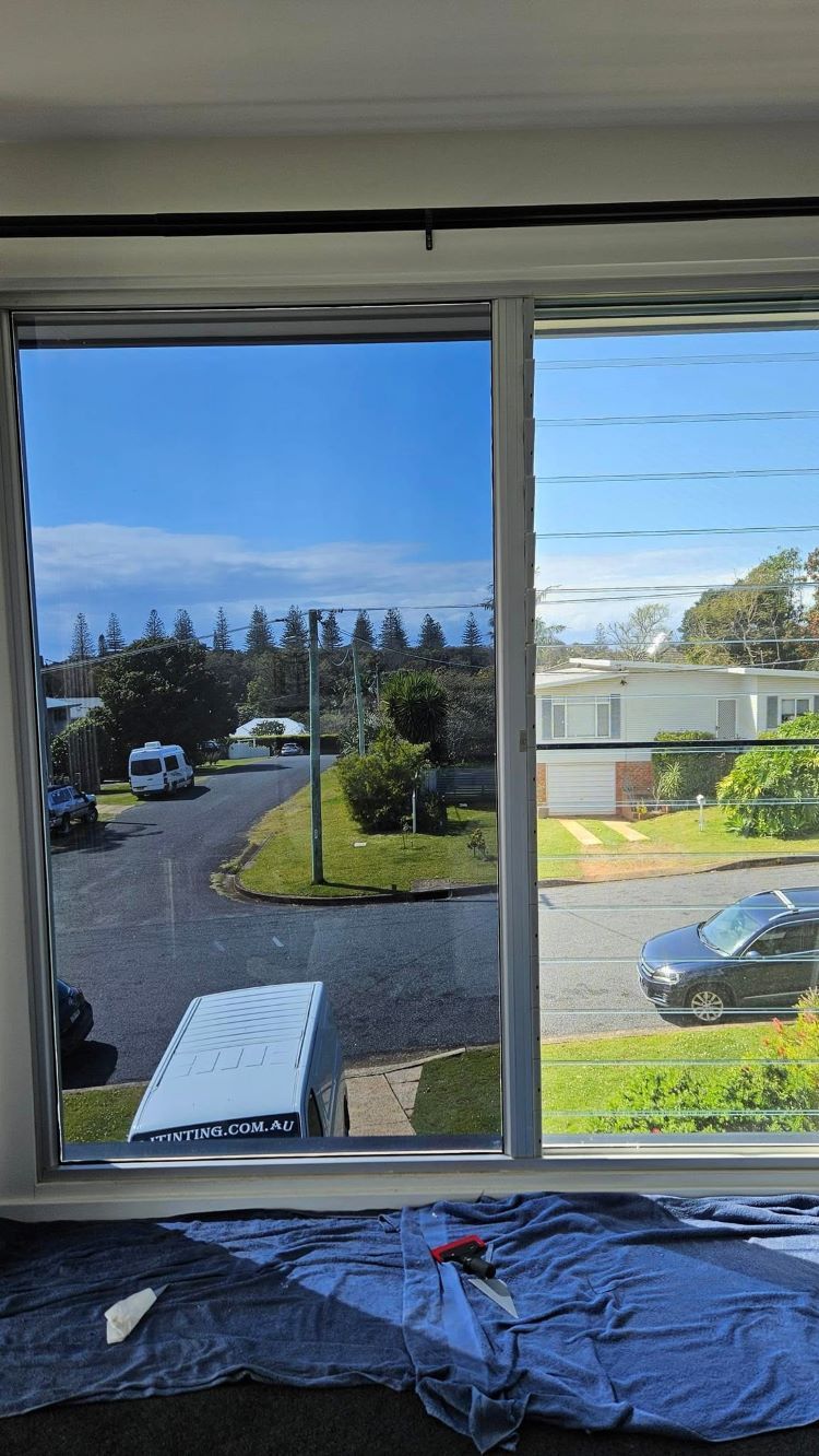 A Window With a View of a Street and a House — PJ Tinting In Bonny Hills, NSW