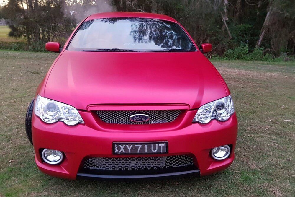 A Pink Car With a Tinted Window — PJ Tinting In Port Macquarie, NSW