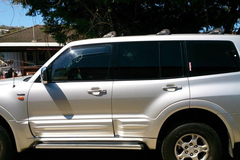 A Silver Suv With a Tinted Window — PJ Tinting In Port Macquarie, NSW