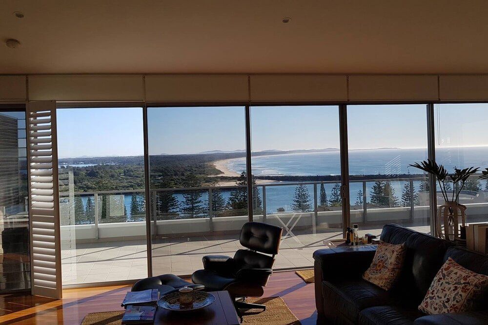 A Living Room With a Tinted Window — PJ Tinting In Port Macquarie, NSW