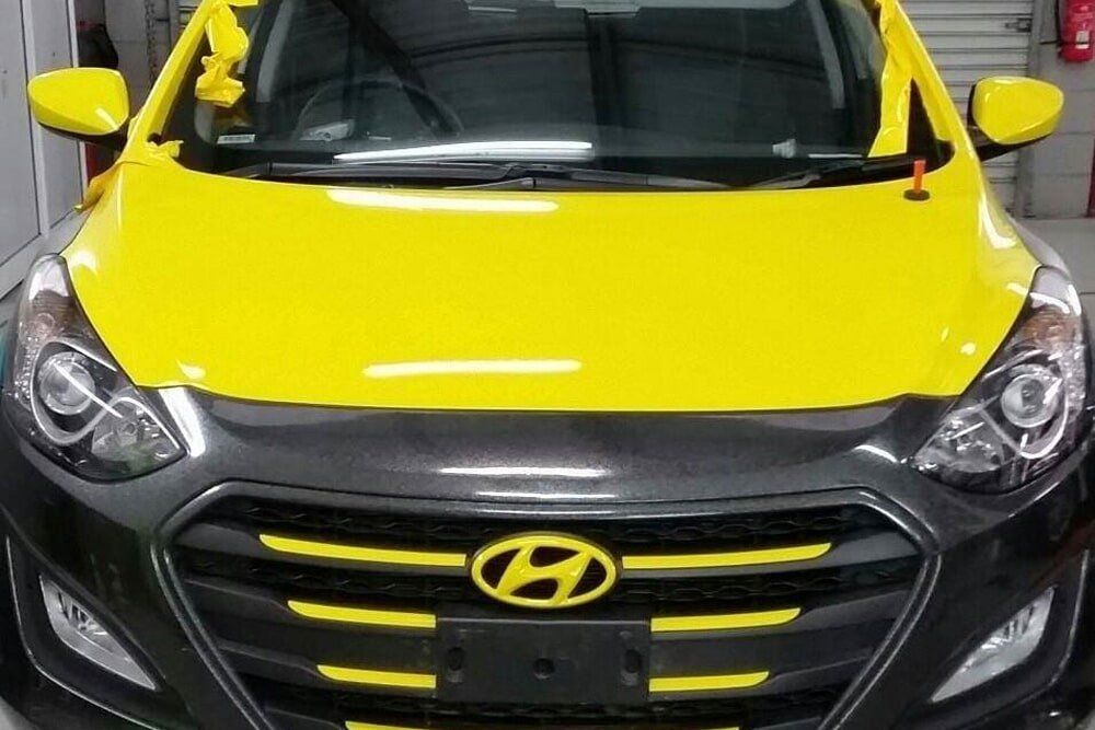 A Yellow Car With a Tinted Window — PJ Tinting In Port Macquarie, NSW