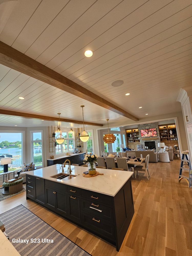A kitchen with a large island in the middle of the room.