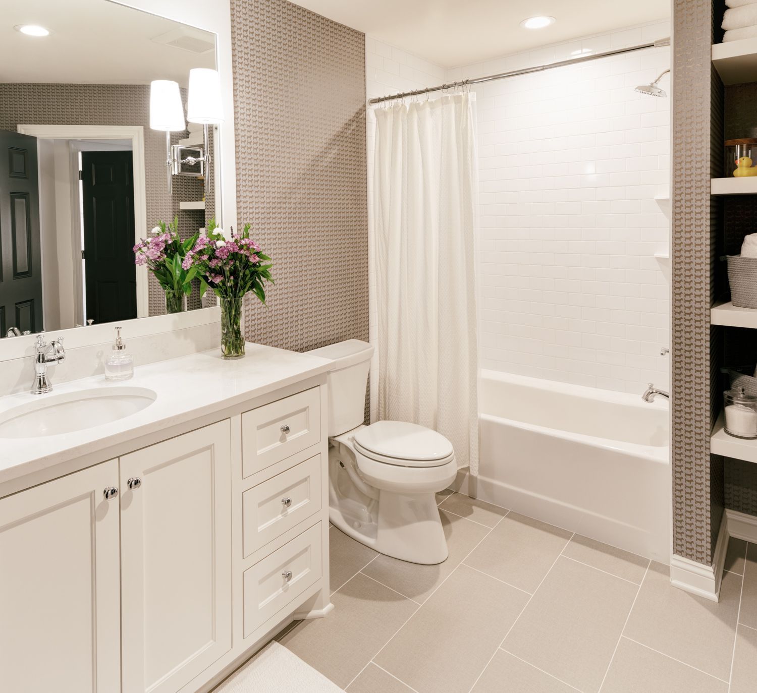 A bathroom with a toilet a sink and a bathtub