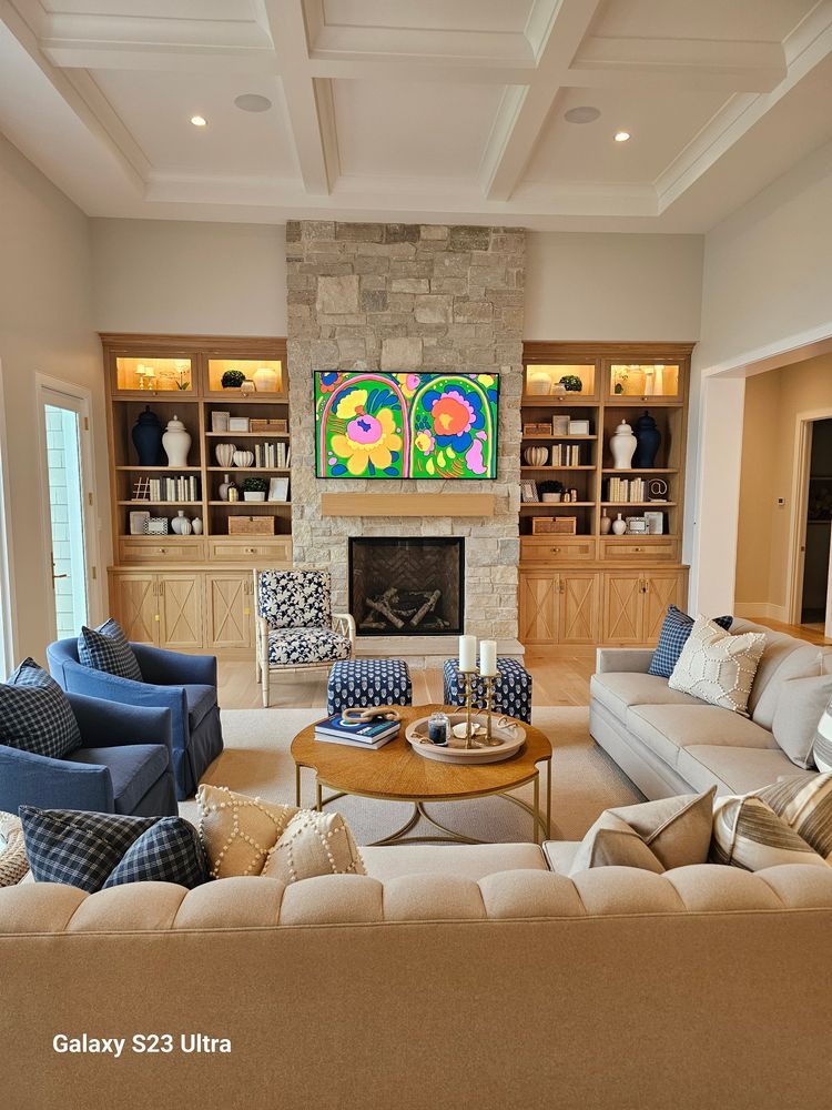 A living room filled with furniture and a fireplace.