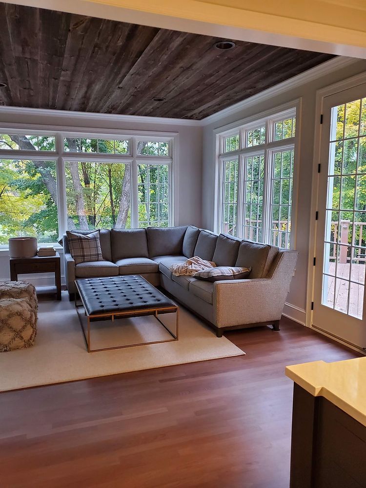 A living room with a sectional couch and a coffee table.