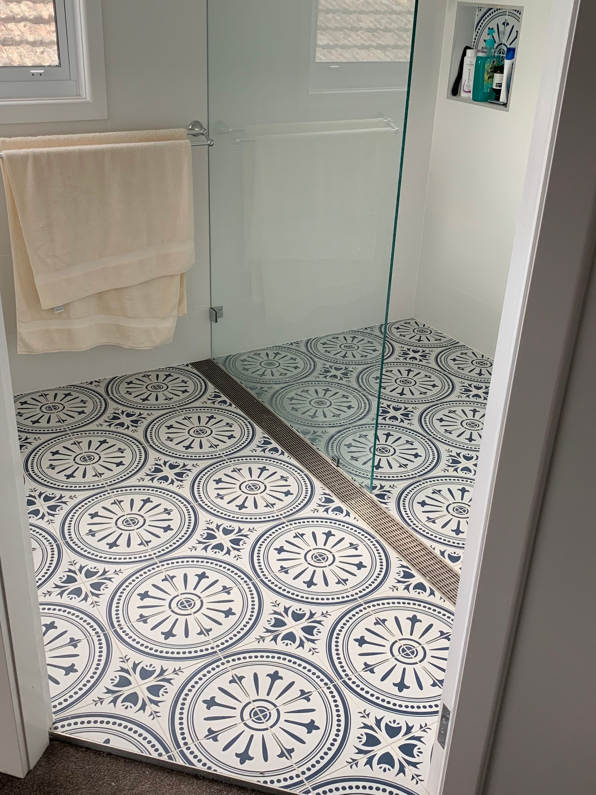 A Man Is Working On A Wooden Deck — Beckers Tiling in Bathurst, NSW