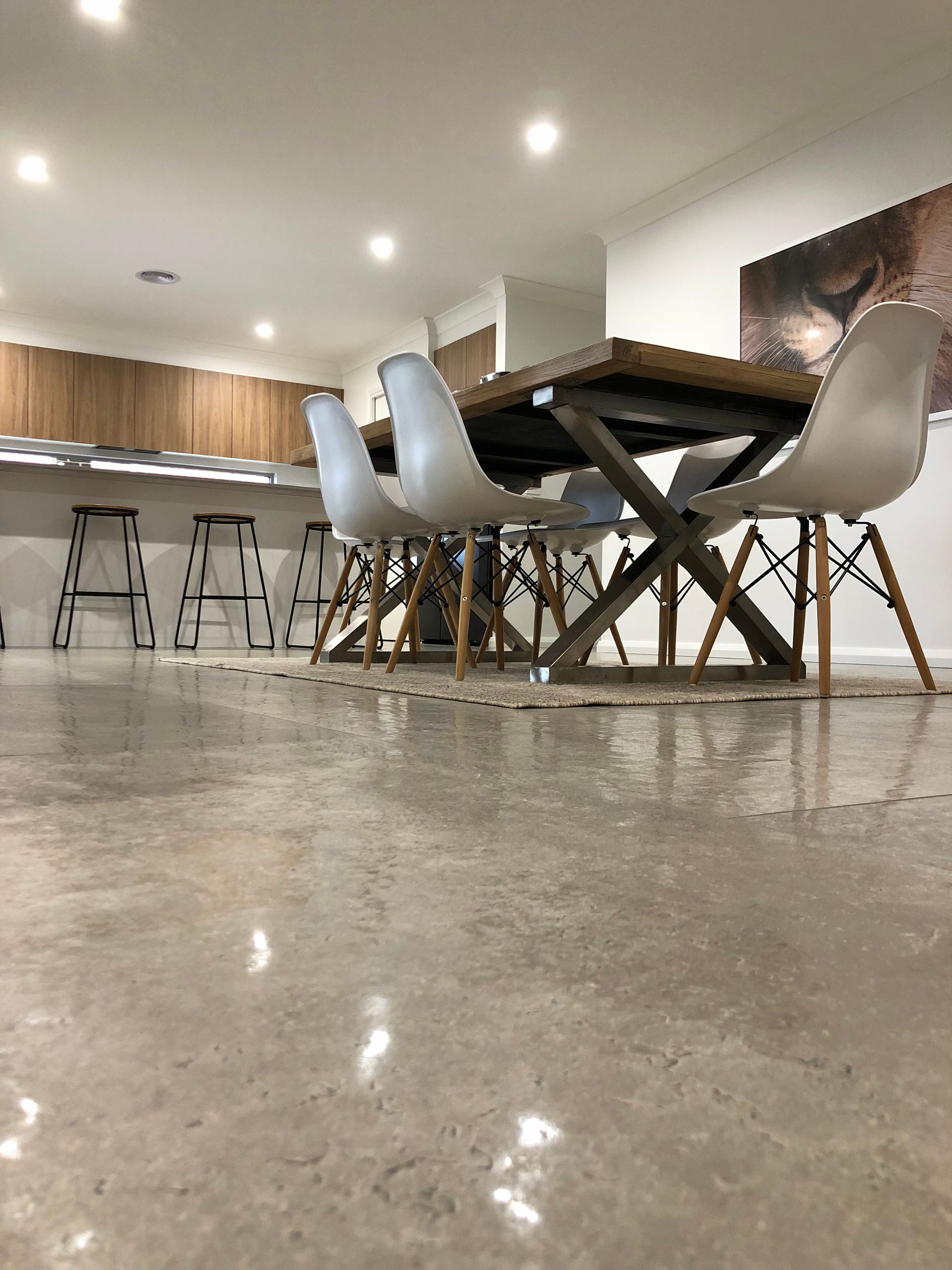 A Bathroom With Two Sinks And A Round Mirror — Beckers Tiling in Bathurst, NSW