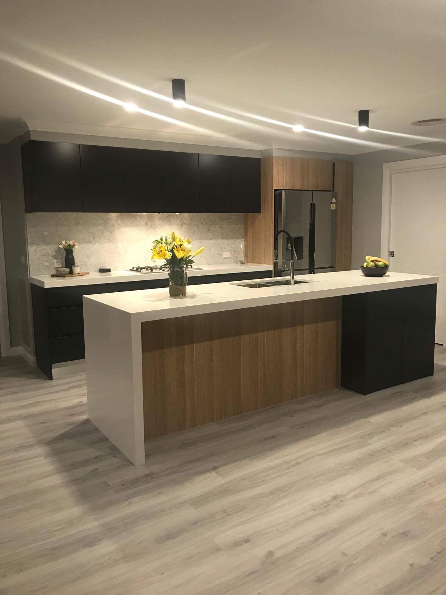 A Kitchen With White Cabinets, A Stove And A Fireplace — Beckers Tiling in Bathurst, NSW