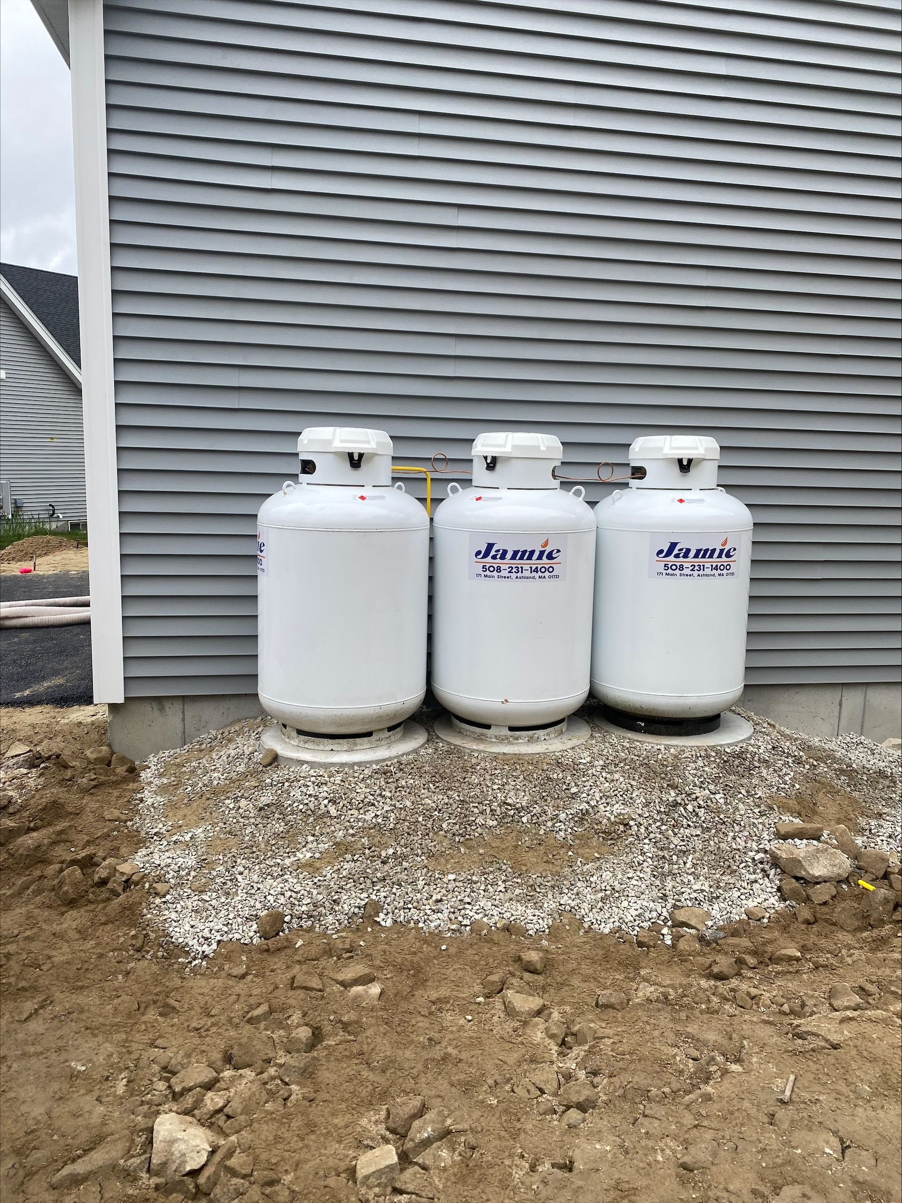 Truck transporting blue propane tanks on a highway for residential propane supplier delivery. Truck transporting blue propane tanks on a highway for residential propane supplier delivery.