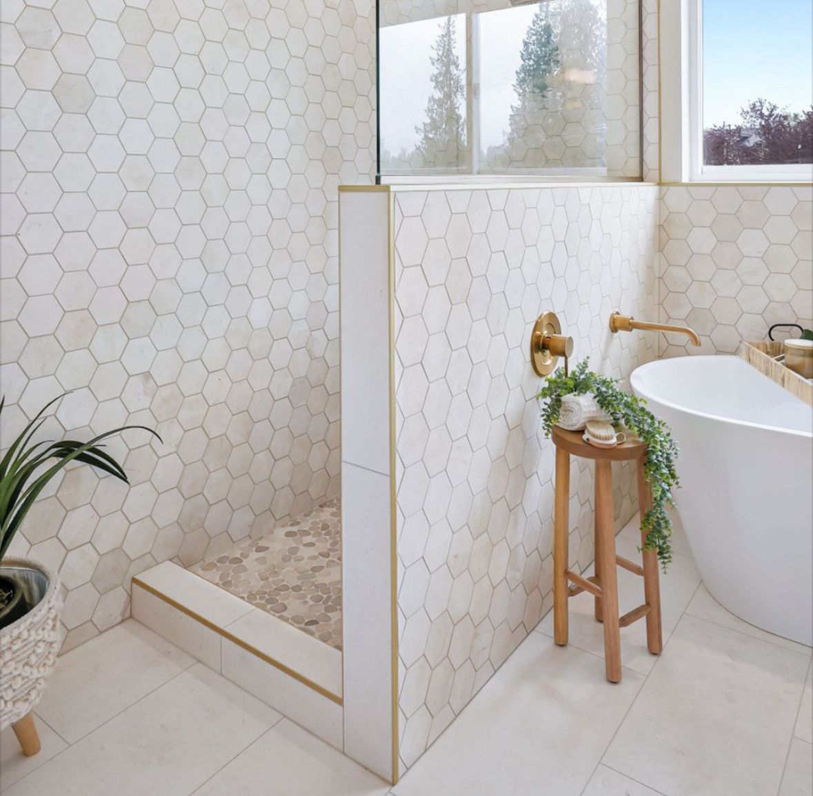Bathroom with hexagonal tile walls, walk-in shower, and a soaking tub. 