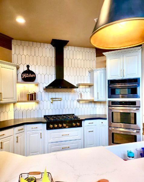 White kitchen with black accents. 