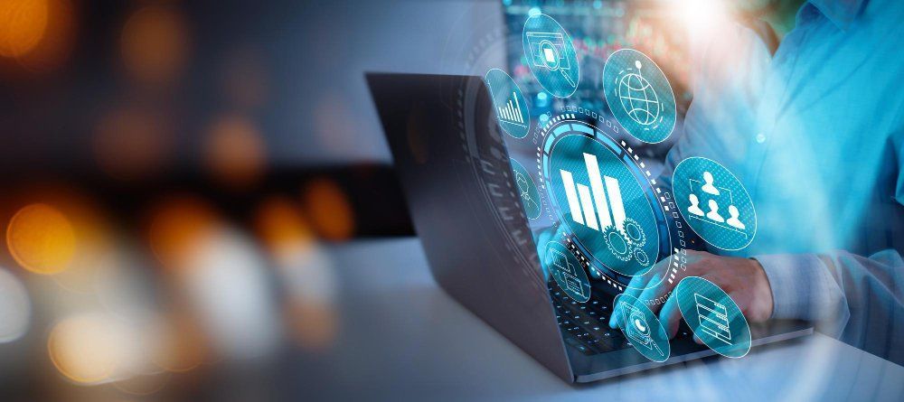 A person is using a laptop computer with a virtual screen coming out of it.