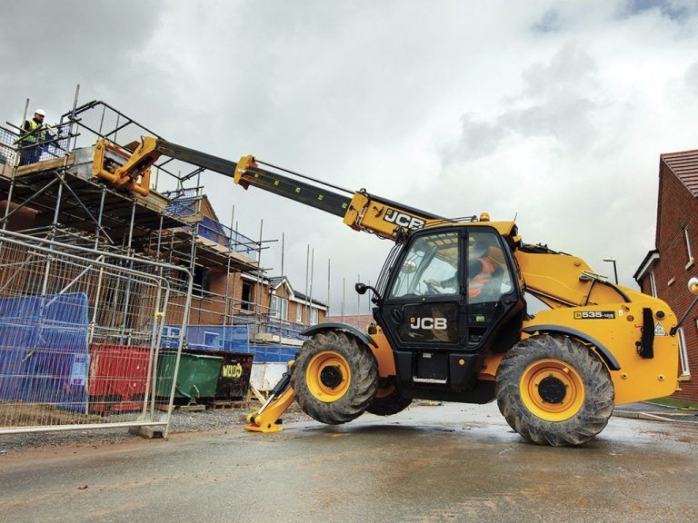 A Forklift is Parked in Front of a Building Under Construction — Advanced Industry Training In South Townsville, QLD
