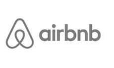 A black and white airbnb logo on a white background