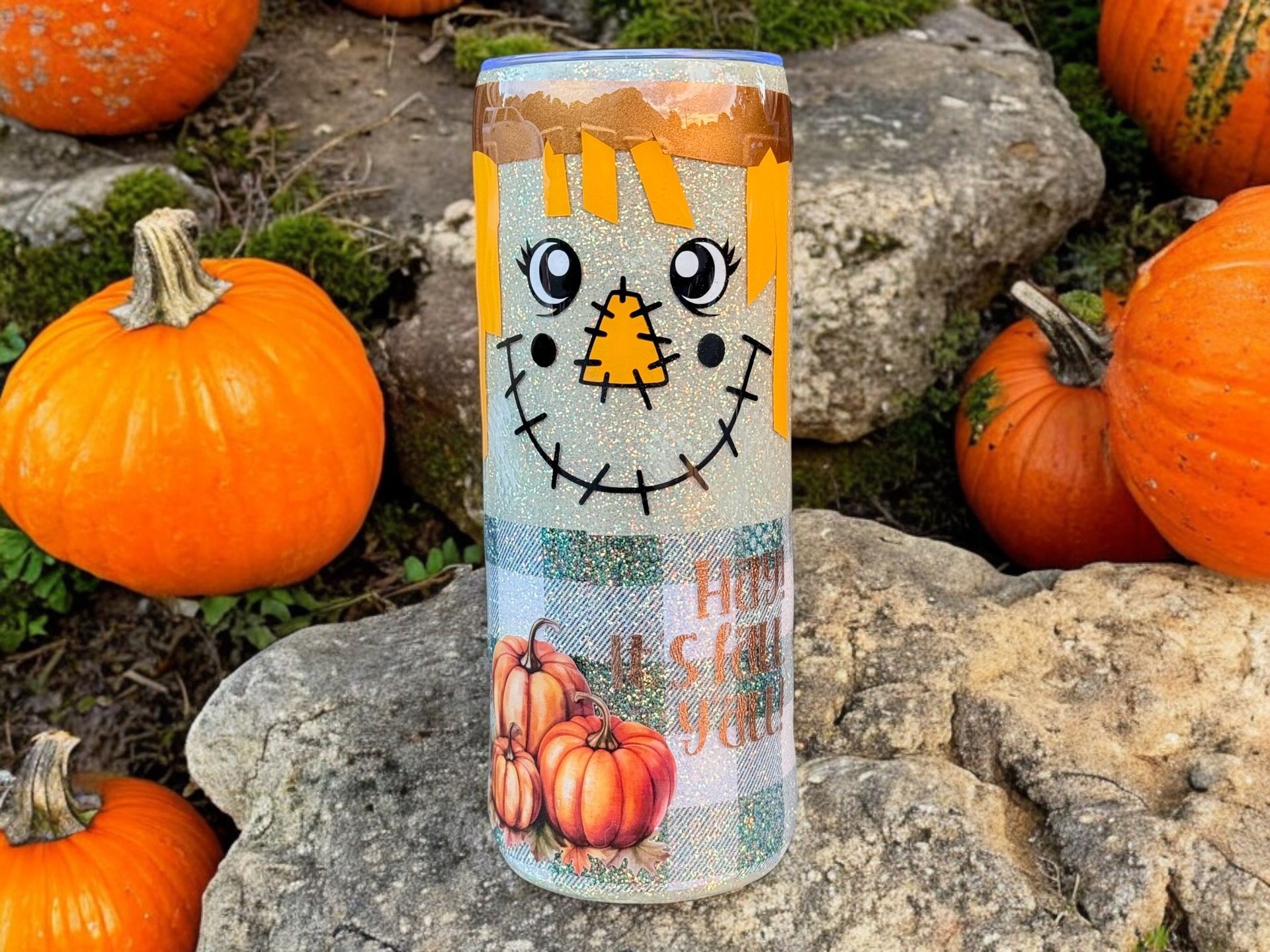 Three fall-themed tumblers decorated as scarecrows, with pumpkins and plaid pattern.