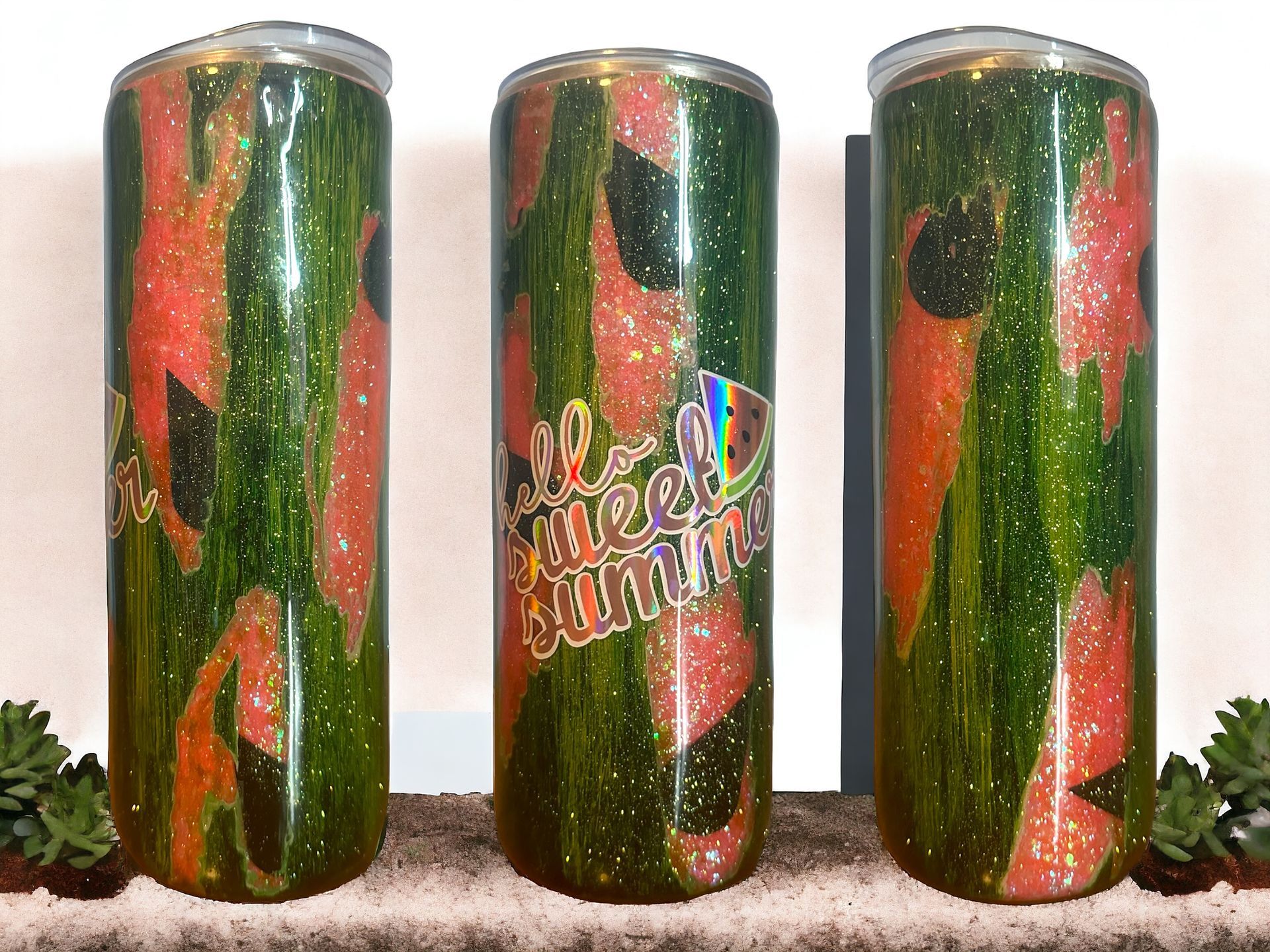 Three glittery watermelon-themed tumblers. Green and red, with a 