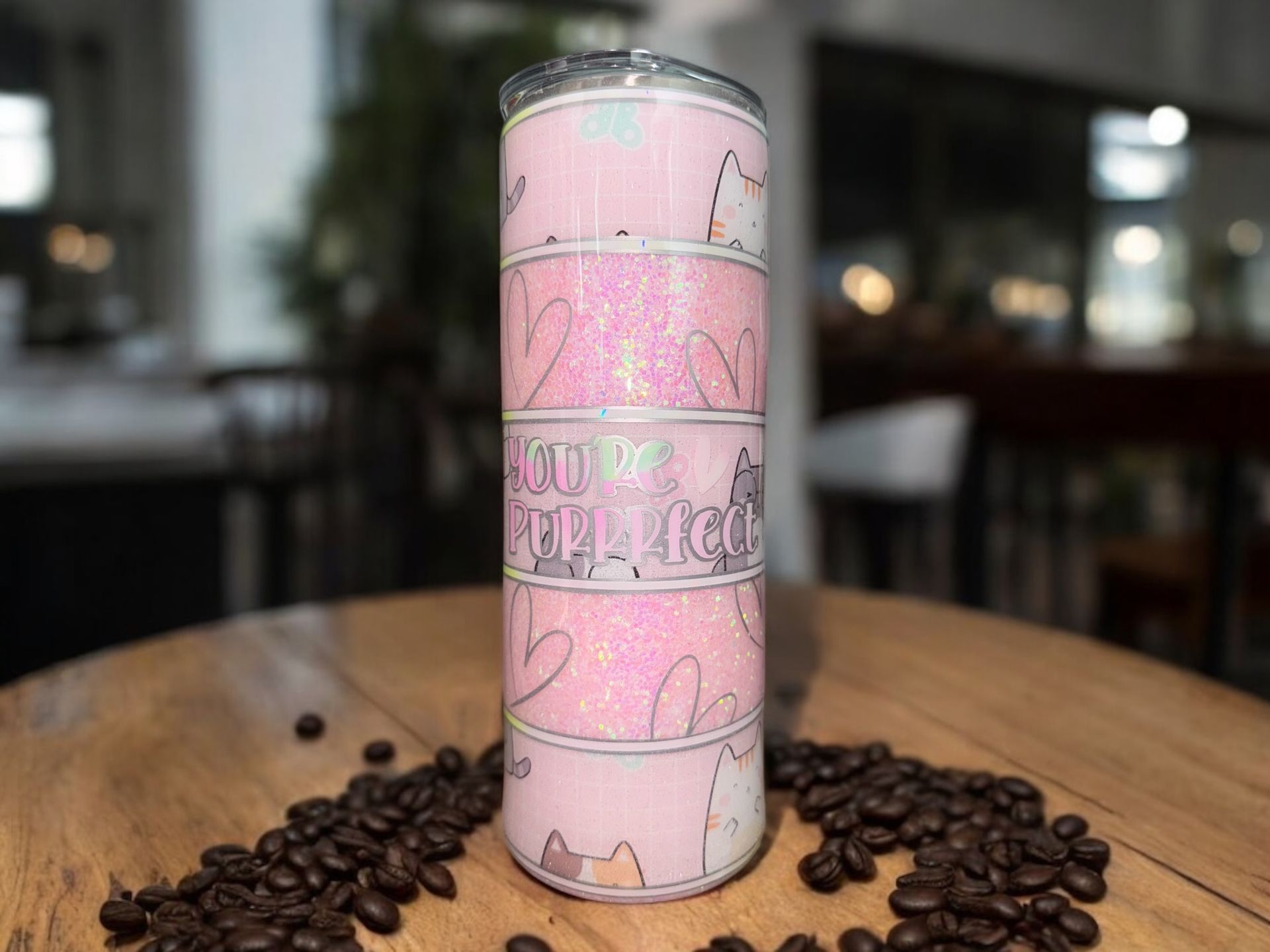Three pink glitter cat-themed tumblers, with a “YOU DO THE MOON” quote on the middle one.