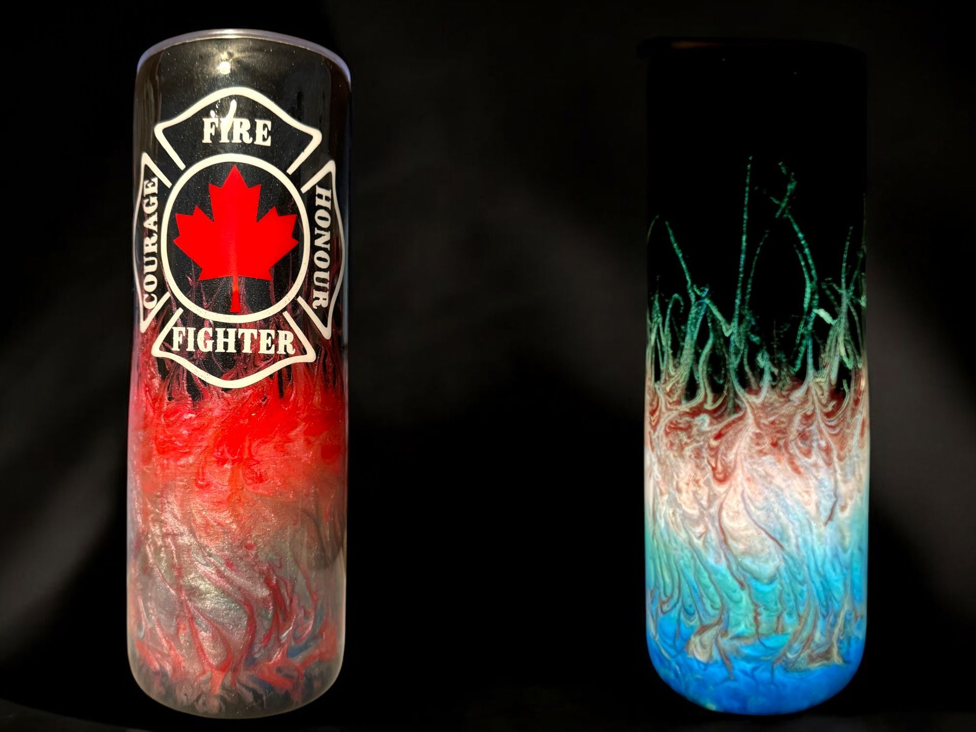 Two customized insulated tumblers. One features a fire fighter logo, the other an abstract blue and green design.