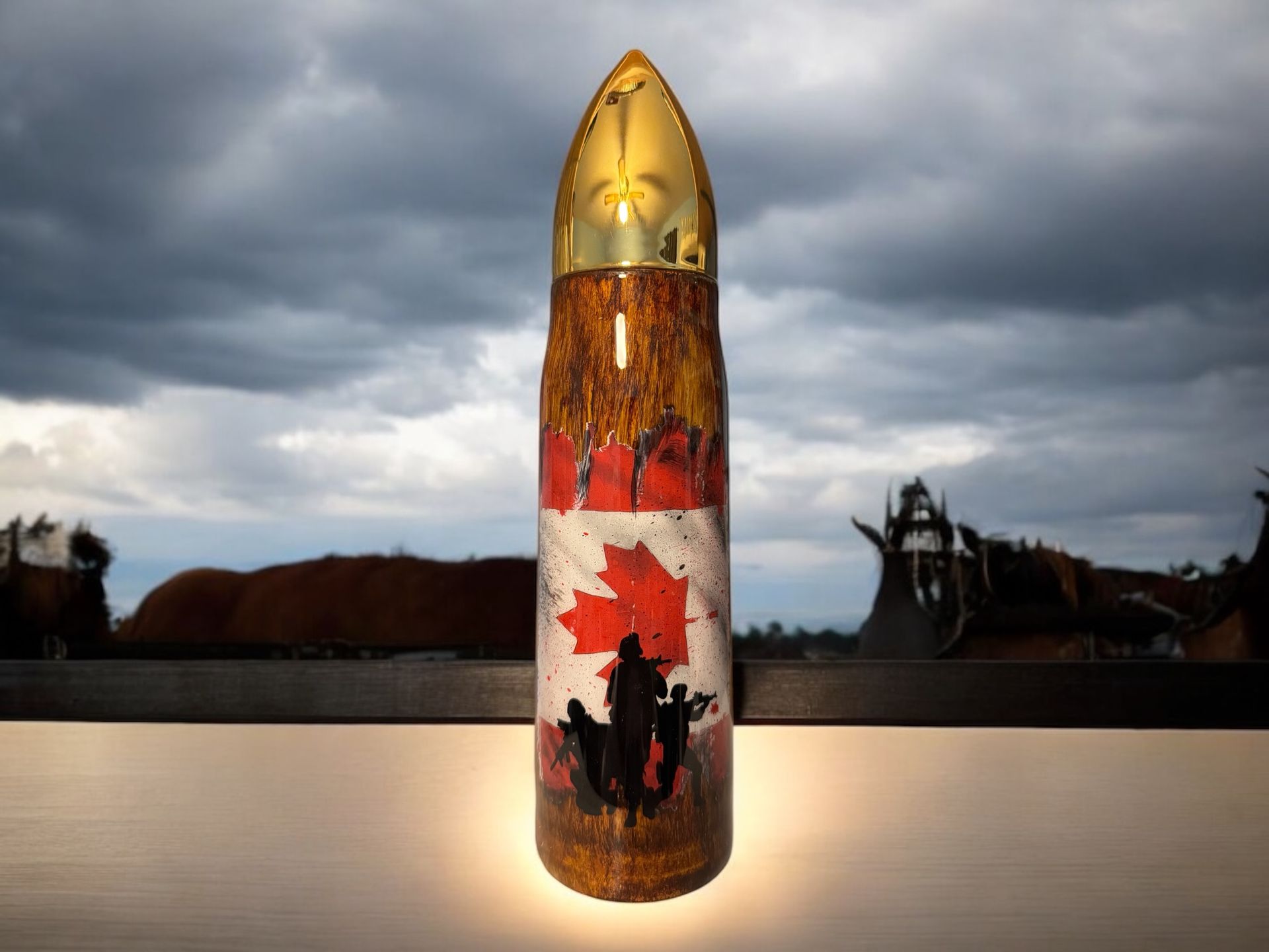 Three bullet-shaped containers with a Canadian flag design. One has 