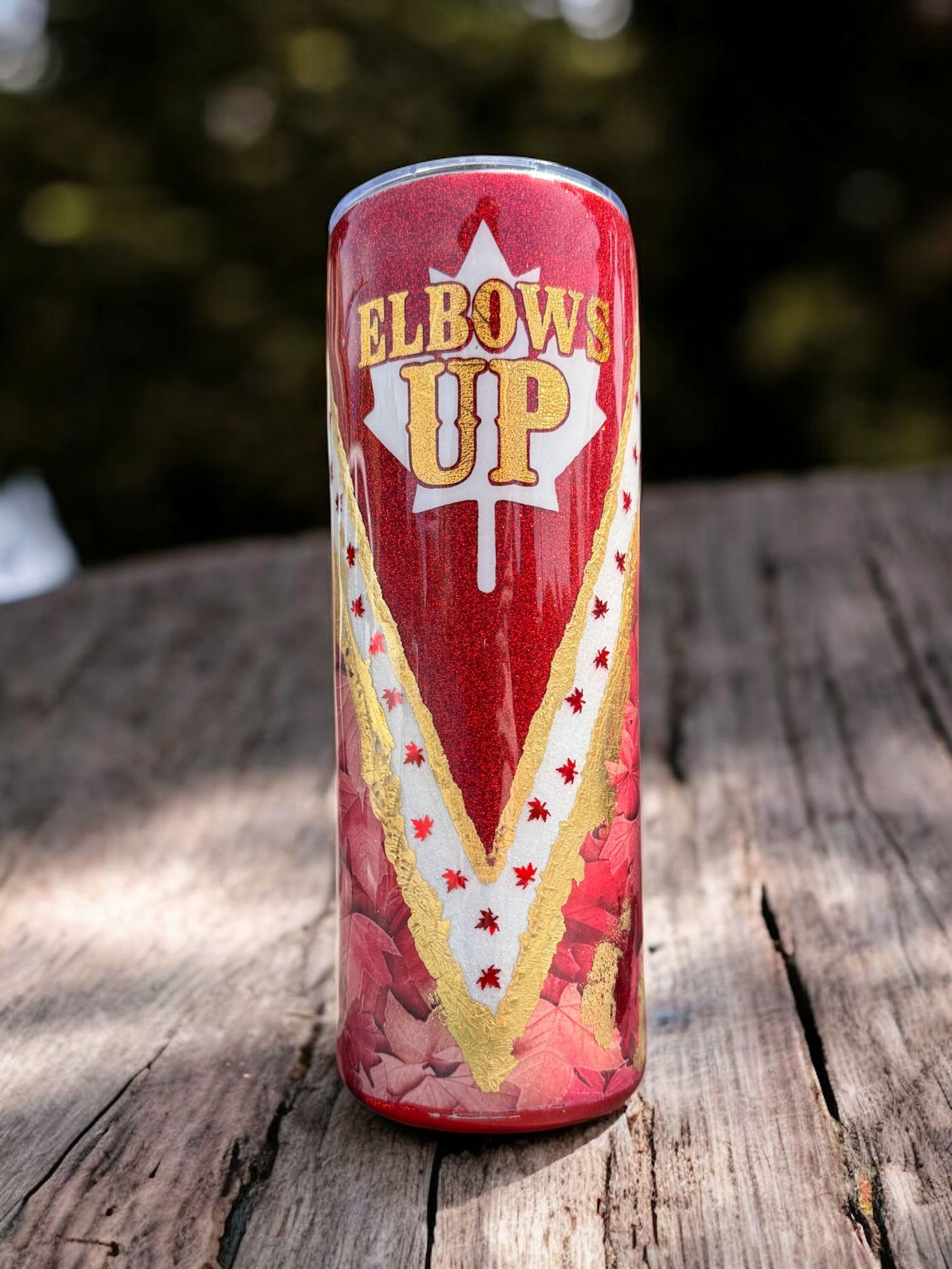 Three red tumblers with 