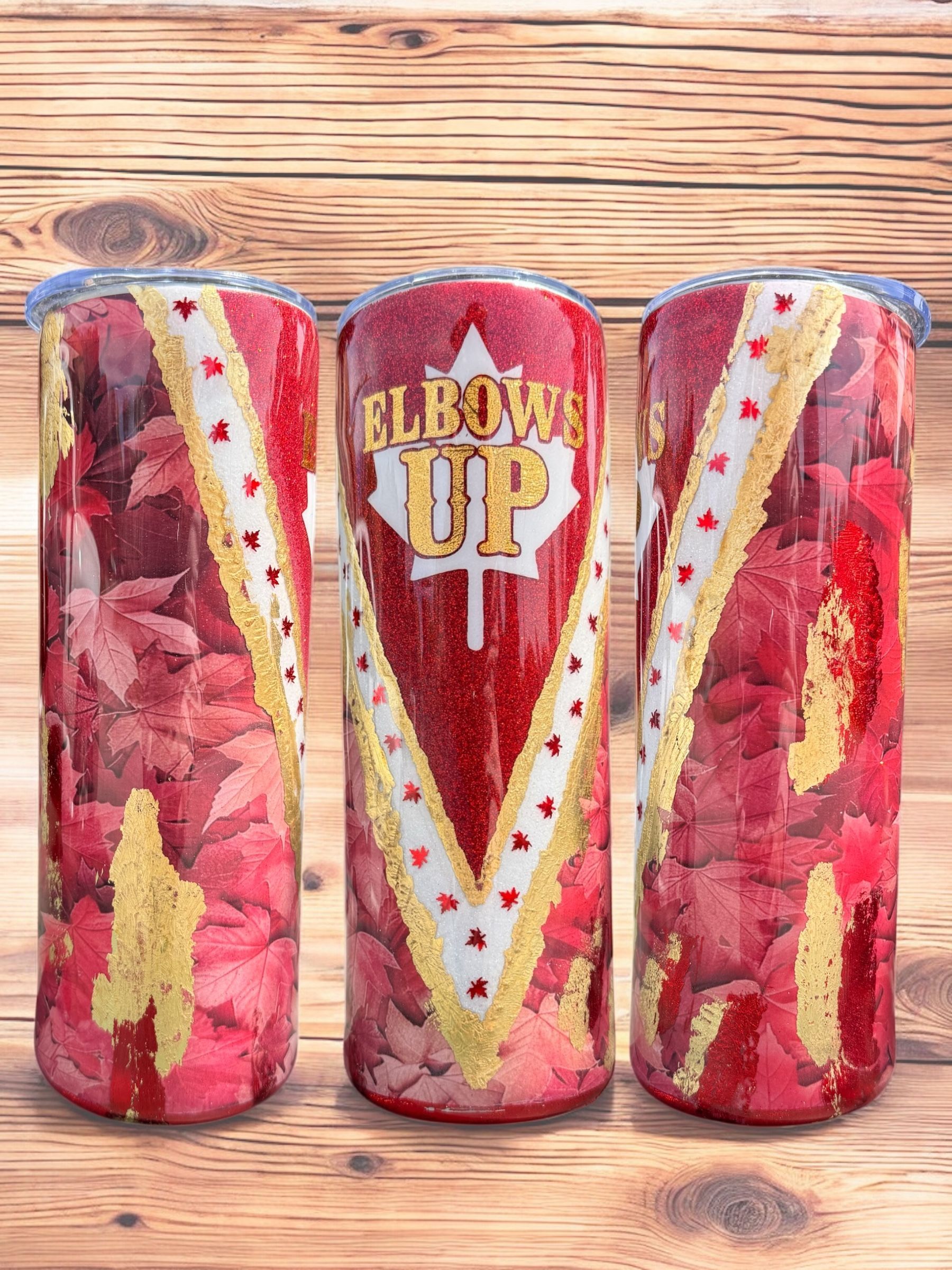 Three red tumblers with 