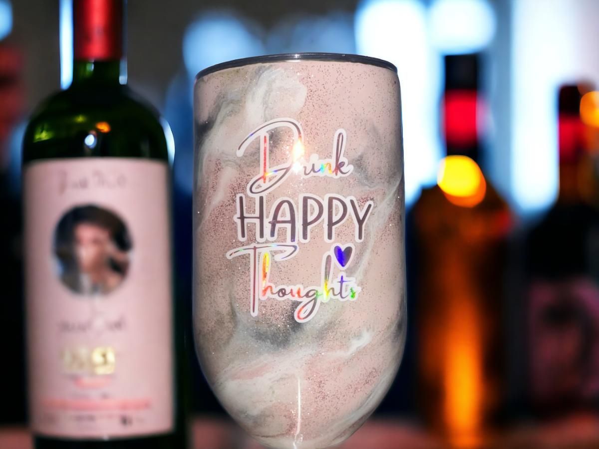 Tumbler with glittery pink, white, and gray swirls, text 