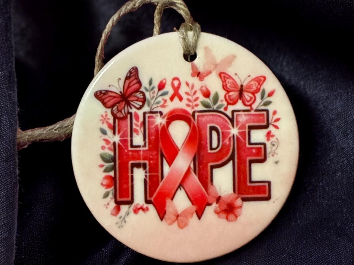 A white ornament with the word hope on it
