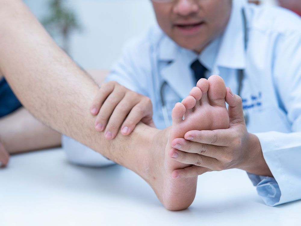 Examining Patient's Feet — Sterling Heights, MI — Intracare Surgery Center