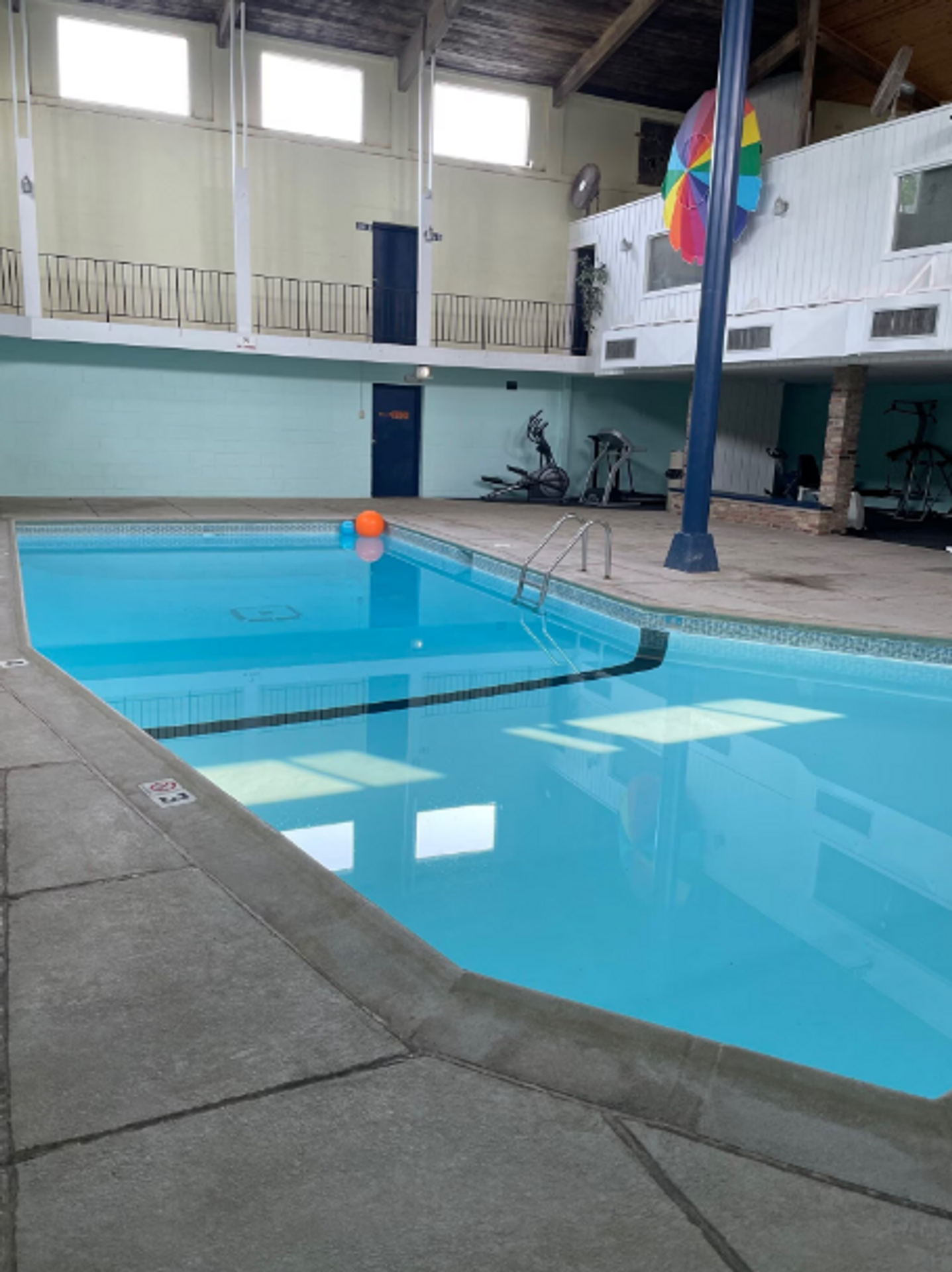 A large indoor swimming pool in a building