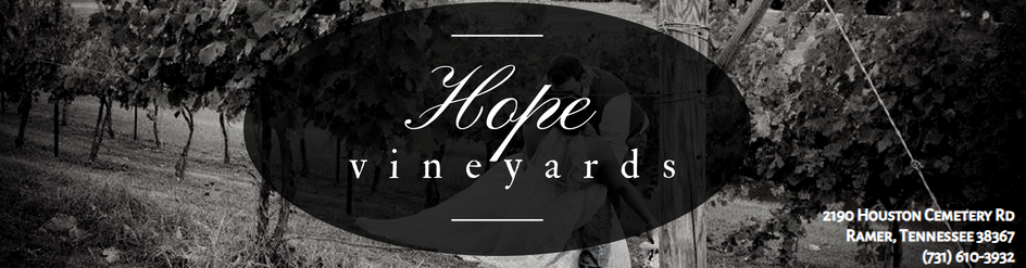 Black-and-white vineyard banner with the words &ldquo;Hope vineyards&rdquo; over a scenic landscape.