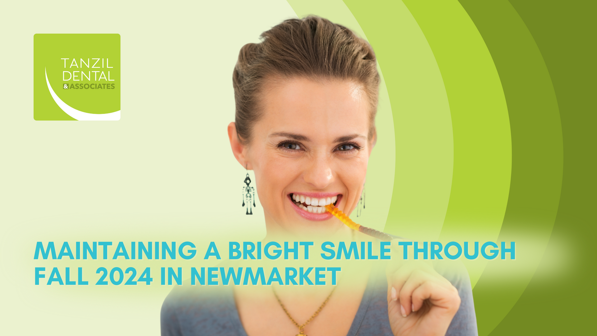 A woman is smiling with a pencil in her mouth.