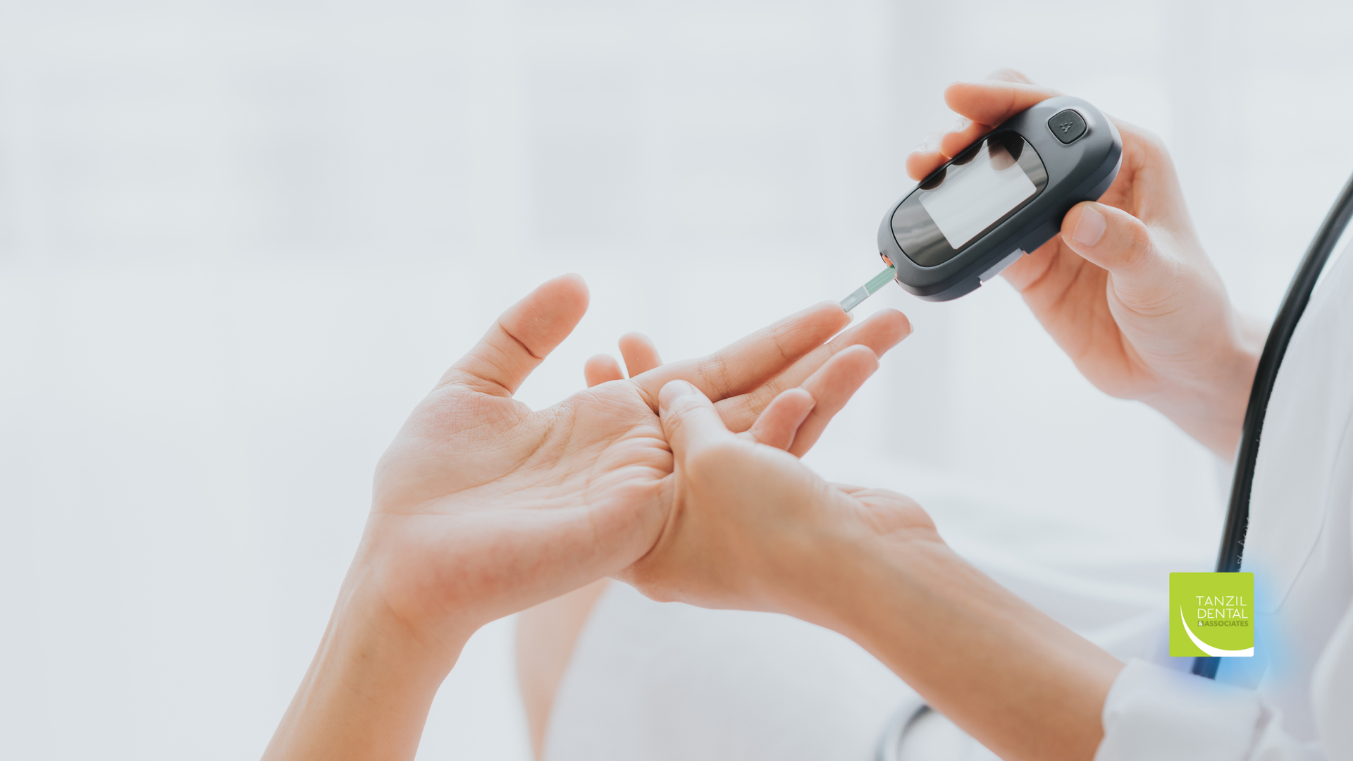 Person checking blood sugar with a glucometer on a patient's finger.