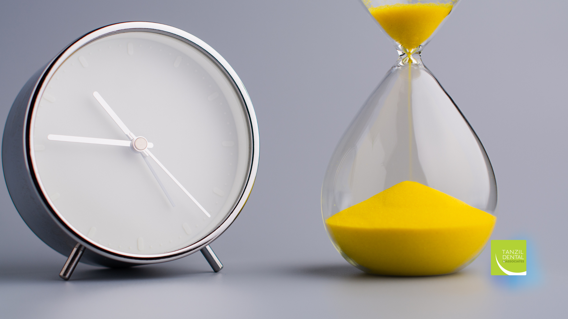 Clock and hourglass side-by-side; clock shows hands near 10 o'clock, yellow sand falling in hourglass.